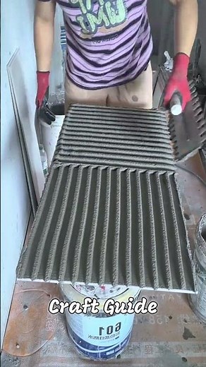 Process of installing large format wall tiles