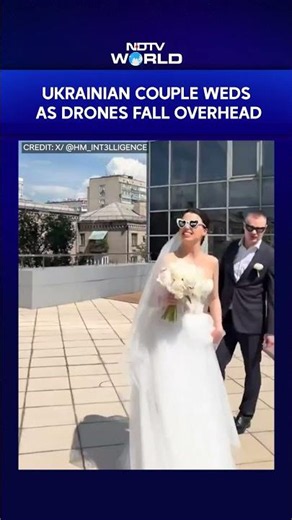 Drone Crash In Background, Ukrainian Couple Continues Wedding Photoshoot