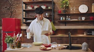 Close up slow motion view of young sleepy chinese man waking up and getting out of bed. Pyjamas look, morning routine, comfort concept. Work day, hurrying up, late in the morning. Male portrait