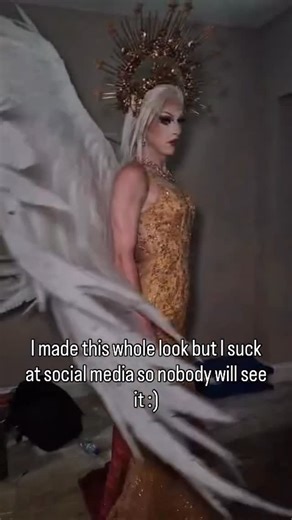 Lucina Schynning on Instagram: "if by some miracle this post comes up in your feed please show it some love 🫶✨ something tells me your angels will be grateful 😉 This Fallen Angel look is one of my proudest creations to date! It took me hours and hours and hours to create all these little details to bring the story I wanted to tell to life, but it all feels so worth it in the end 🪽🕊️ #drag #queen #design #craft #fashion"