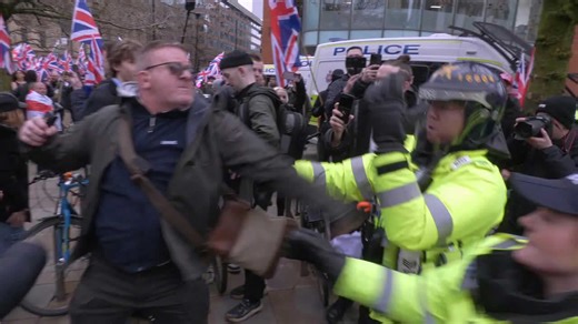 Police officer punched in face in Manchester as counter-protesters clash with 'Britain First' supporters