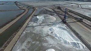 Industrial extraction of salt. Salt warehouse and conveyor outdoor.