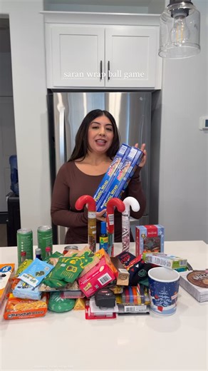 Sincerely Gabs | Content Creator on Instagram: "the Saran Wrap ball game is a must in our family every year 🎄 #saranwrapballgame #saranwrapball"