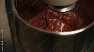 The process of preparing dough for a sponge cake. The ingredients of the sponge cake are mixed in a blender. The concept of confectionery preparation of products and cakes