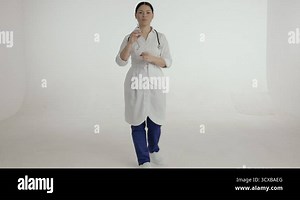 Asian female nurse in white medical unifrom Stock Video Footage - Alamy