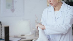 Doctor examining patient with foot injury, clinical examination, diagnostic