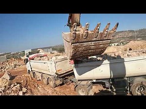Hitachi 350 Excavator Loading Rocks into a Truck – Precision in Action!