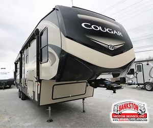Check out this Keystone Cougar 315RLS- you are sure to love the LG solid surface countertop upgrade in the galley, the two TVs, the Cougar vintage maple glazed hardwoods, and much more! https://www.bankstonmotorhomes.com/product/new-2019-keystone-rv-cougar-315rls-1024269-5 | Bankston Motor Homes | Facebook