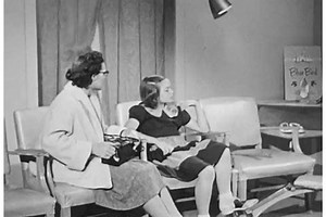 clip-28035652-1950s-shoe-salesman-helps-little-girl-try
