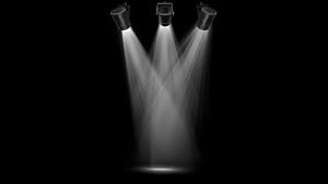 Realistic white light beam from above on black background.