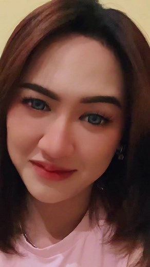 Person in Pink Top with Shoulder-Length Hair