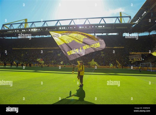 Dortmund, Deutschland: 26. April 2026 - 1. Bundesliga - 31. Spieltag - Borussia Dortmund vs. SC Freiburg Im Bild: Symbolbild Signal Iduna Park / Westfalenstadion Innenraum mit Fahnenträger DFL regulations prohibit any use of photographs as image sequences and/or quasi-video. (Photo by HMB Media/Madeleine Fantini/Sipa USA Stock Photo - Alamy