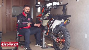 The Risk Racing Lock-N-Load Pro Moto Transport System securely holds your motocross bike in your trailer without the use of tie-down straps, floor anchors, or wheel chocks. It takes an enormous amount of pressure off of the fork seals during transit, and it frees up valuable space to allow the transport of more motorcycles or gear. Additionally, the Lock-N-Load can be quickly removed from the trailer floor by loosening the two screws and removing the struts, leaving only the low profile mounting