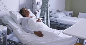 Woman lying in a hospital bed 4k