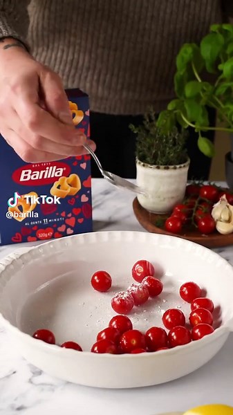 Warning: this recipe is like a cupid's arrow straight to your heart! 💘 Ingredients (serving 4): 320g Barilla heart-shaped pasta 20 ripe cherry tomatoes, washed and halved\t 2 cloves garlic 60ml extra virgin olive oil 1 lime or lemon salt and fresh thyme to taste\t 2g icing sugar\t 50g basil 200g burrata, chopped Method: Season the cherry tomatoes with salt, garlic, olive oil, thyme and sugar and arrange in a baking tray. Roast in a pre-heated oven at 120° for about 1 hour. Blanch the basil in b