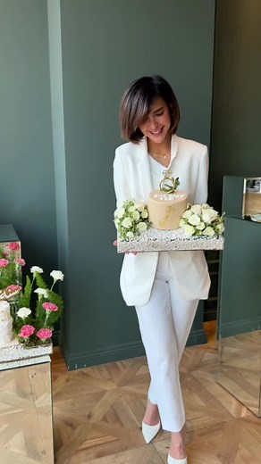 Elegant Proposal Setup with Cake and Flowers