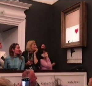136K views · 2.1K reactions | This is the moment a painting by Banksy shred itself into pieces as soon as it sold for almost $1.9 million at an auction  | ABC News | Facebook