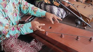Indonesian people wear traditional clothes (batik) and play the kacapi for an entertainment event in Yogyakarta, Indonesia Stock Video