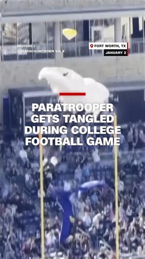 Paratrooper gets tangled during college football game