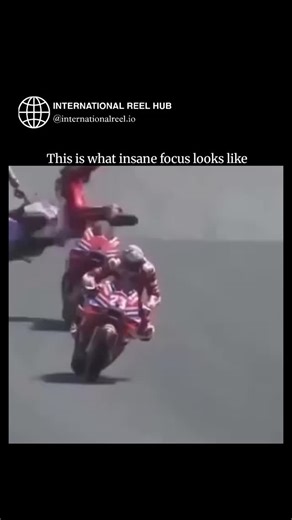 🌍 INTERNATIONAL REEL HUB on Instagram: "The post showcases a 15-second video of a rider in red American-flag leathers executing an extreme front-wheel balance on a red Ducati-style motorcycle, captioned to symbolize peak mental concentration under pressure. Replies overwhelmingly dismiss it as AI-generated or video game footage, citing unnatural physics like impossible lean angles and fluid motion, with over 200 responses sparking debates on digital vs. real stunts. This viral clip (2M+ views) 