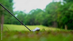 Golf slow motion golfer hitting golf ball in tee off area on morning in beautiful golf course. Fairway and layout beauty and player exercise to good health and relaxation stay activity in the holiday.