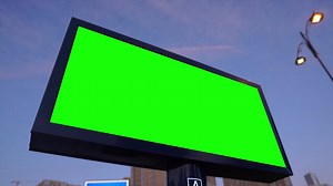 Green screen billboard on urban, city life. Blank advertisement panel, banner for marketing. Chroma key empty sign. | Premium Stock Video Footage