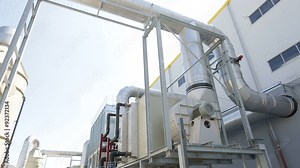 New modern industrial waste plant pipelines from the outside. Waste-to-energy plant. Produces a combustible fuel commodity, such as methane, methanol, ethanol and synthetic fuels.