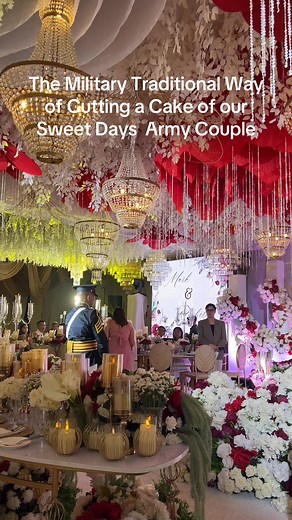 The military traditional way of cutting a cake symbolizes unity and honor, often performed with a sword to represent the couple’s strength and commitment. | Sweet Days Weddings and Events Management