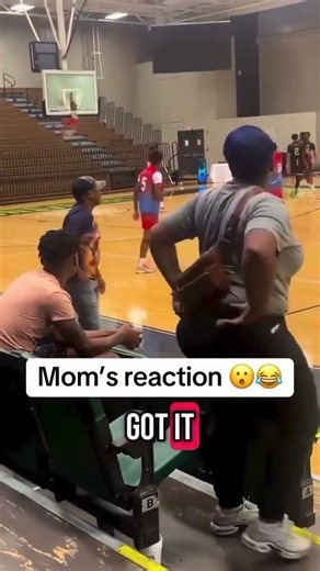Basketball player breaking hoop rim.