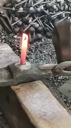 Steel nail making process using heated iron forging