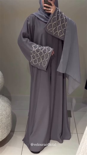 𝐕𝐄𝐋𝐎𝐔𝐑𝐀 𝐀𝐁𝐀𝐘𝐀𝐒 on Instagram: "𝐆𝐫𝐚𝐜𝐞 𝐢𝐧 𝐞𝐯𝐞𝐫𝐲 𝐭𝐡𝐫𝐞𝐚𝐝. This elegant grey abaya with delicate silver embroidery is made for the woman who loves modesty with a touch of luxury. ✨ Simple. Classy. Timeless. Details: • Color: Soft Grey + available in beautiful colors • Fabric: Flowing, lightweight korean nida fabric for all-day comfort • Design: Silver embroidered pattern on sleeves and matching scarf • Style: Front-open, modest fit • Includes: Abaya + matching hijab . .