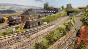 69005 passing Penberth Junction with a short engineers train consisting of an Osprey, mesh sided OBA and a 12t Plasser Crane. | Liskerth