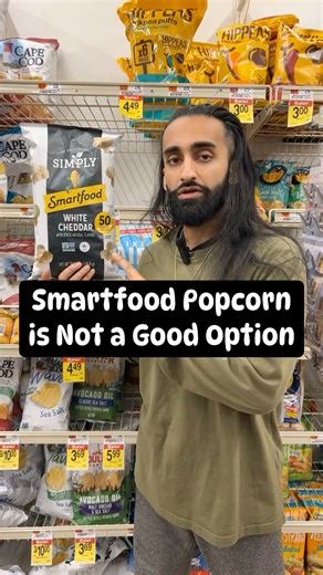 🚫 Stay away from smart food white cheddar popcorn! 🚫 It’s packed with low-quality ingredients like sunflower oil, ‘natural’ flavors, and more. 🤢 Instead, opt for organic popcorn cooked in heart-healthy extra virgin olive oil and sea salt. 🍿✨ Check out my favorite from LesserEvil Snacks, the ‘Oh My Ghee’ flavor! 😋 #popcorn #smartfood #lesserevil | imjustwasim