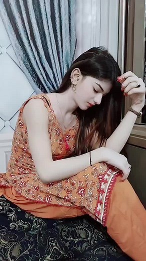 Traditional Outfit Showcase: Orange Floral Elegance