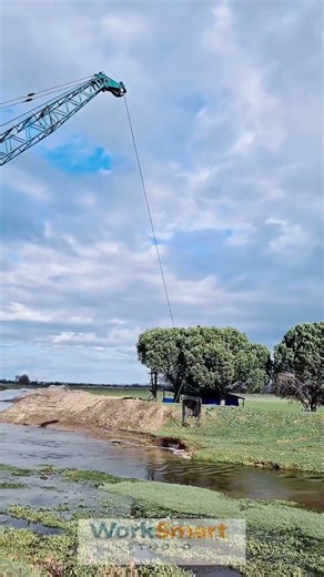 River Dredging Excavator Bucket by Crane Operator: Lifting and Dragging Sediment Cleaning Process