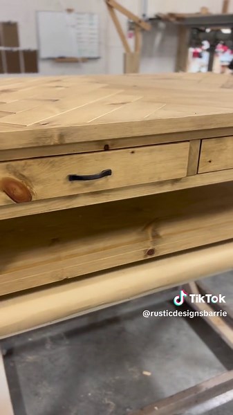 This honey stained herringbone style coffee table was designed and built for a cottage home. Stylish, rustic, charming & practical! #coffeetable #coffeetabledecor #coffeetables #cottage #cottagelife #cottagefurniture #cottagefurnishings #rustic #rusticfurniture #woodfurnituredesign #woodfurniture #solidwoodfurniture #solidwood