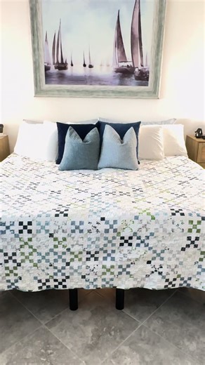 I LOVE IT!! 💙💚🩵 king size postage stamp quilt (pattern from Feb 2026 #AmericanPatchworkandQuilting magazine) with #nantucketsummer fabric from @Fat Quarter Shop #quilttok #quiltersoftiktok #sewingtiktok