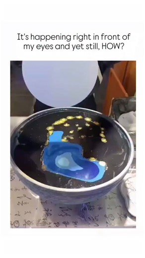 fuuukey on Instagram: "The post features a 17-second video of an artist using a spatula to mix and scoop vibrant fluid acrylic paints from a black bowl onto a white circular canvas, creating mesmerizing swirling patterns that blend blue, gold, and black hues into abstract art. This technique, known as spatula fluid painting and popularized by creators like Tiktus de Jager since early 2025, relies on the low viscosity of acrylics and precise scooping to achieve seamless color flows without brushe