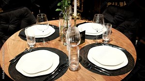 Elegantly made empty dinner tables in a chic restaurant shot with a slider