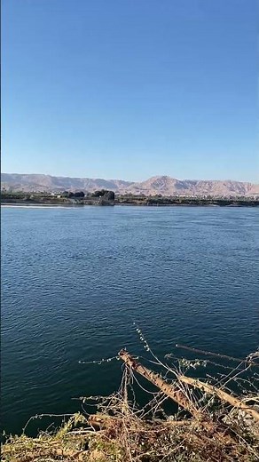 Panoramic View Of The Tranquil Nile River And Distant Mountains - Egypt