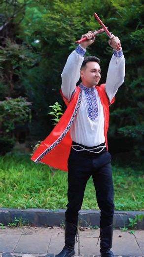 Look at these Uygur #dancers! He wears red-white traditional clothes, holds red props—moves strong and passionate. She has a black-red gradient dress with gold patterns, dances softly with hands overhead 💃. #Xinjiang #dance | Discover Xinjiang