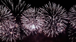 Colorful fireworks exploding in the night sky. Celebrations and events in bright colors. | Premium Stock Video Footage