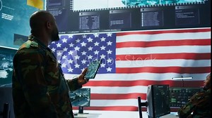 Angry army expert in a command post power base monitors satellite footage, yelling at soldier and throwing papers. Frustrated officer looks at real time data for operational success. Camera B. Stock Video