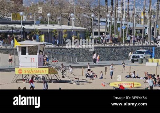 crowds on barcelona beach in la barceloneta neighborhood in spring Stock Video Footage - Alamy