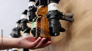 Bar counter with draft beer. Draft beer in plastic bottles