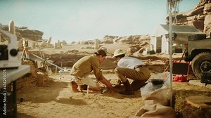 Archaeological Digging Site: Two Great Archeologists Work on Excavation Site, Carefully Lifting Newly Discovered Ancient Civilization Cultural Artifact, Historical Clay Tablet, Fossil Remains