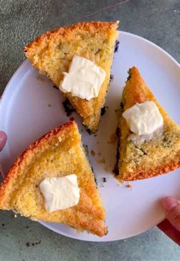 Sweet, buttery, and bursting with blueberries 💙 This Blueberry Cornbread with Honey Butter has swirls of blueberry compote whipped honey butter 🧈 #BlueberryCornbread #HoneyButter #Cornbread #Blueberryrecipes #BlueberrySeason