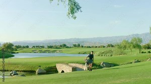 Woman playing golf in beautiful golf course in Palm Springs