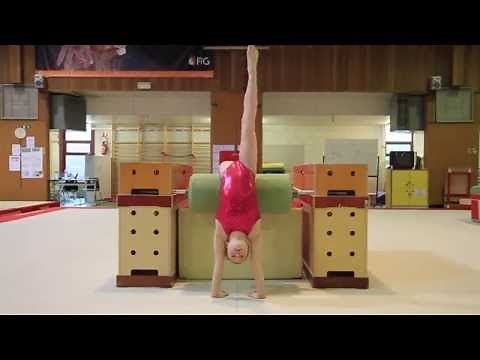 Gymnastics: Back handspring with step-out on the beam