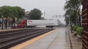 3.7M views · 5.8K reactions | Watch as a BNSF freight train crashes into a semi-truck at the La Grange Road crossing in La Grange, Illinois around 1:52 p.m. today. The massive impact drags the truck down the tracks, tearing through crossing equipment and damaging parts of the nearby train station. : Windy City Railfan | Chicago Critter Media | Facebook